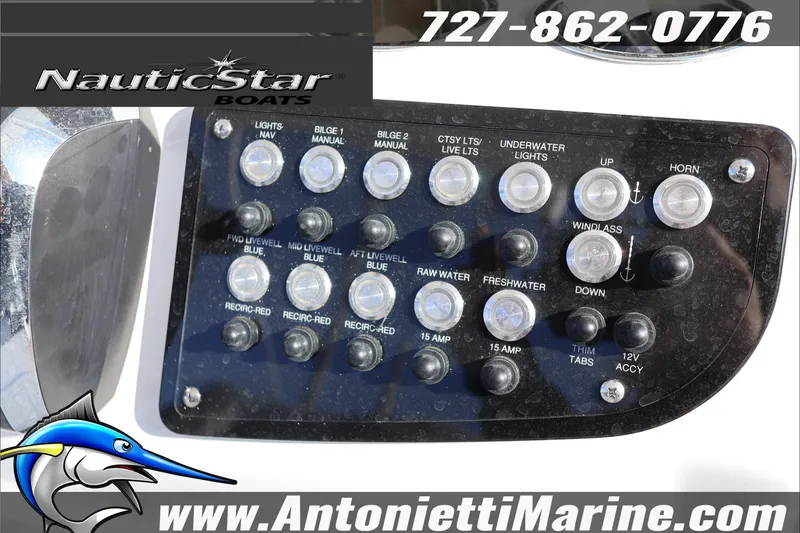 Slide: The Image of Control panel of a 2026 NauticStar 251 Hybrid boat with various switches and buttons. - 18