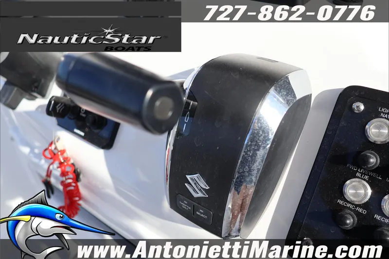 Slide: The Image of 2026 NauticStar 251 Hybrid boat controls with Suzuki throttle and marine switches. - 19