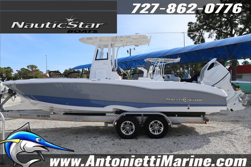 Slide: The Image of 2026 NauticStar 251 Hybrid boat on trailer at Antonietti Marine dealership. - 2