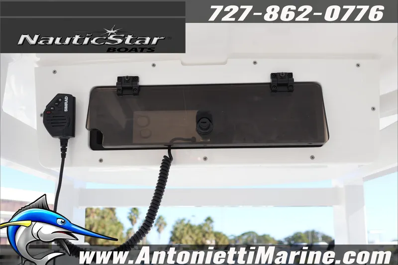 Slide: The Image of 2026 NauticStar 251 Hybrid boat console with Simrad radio, Antonietti Marine branding. - 22