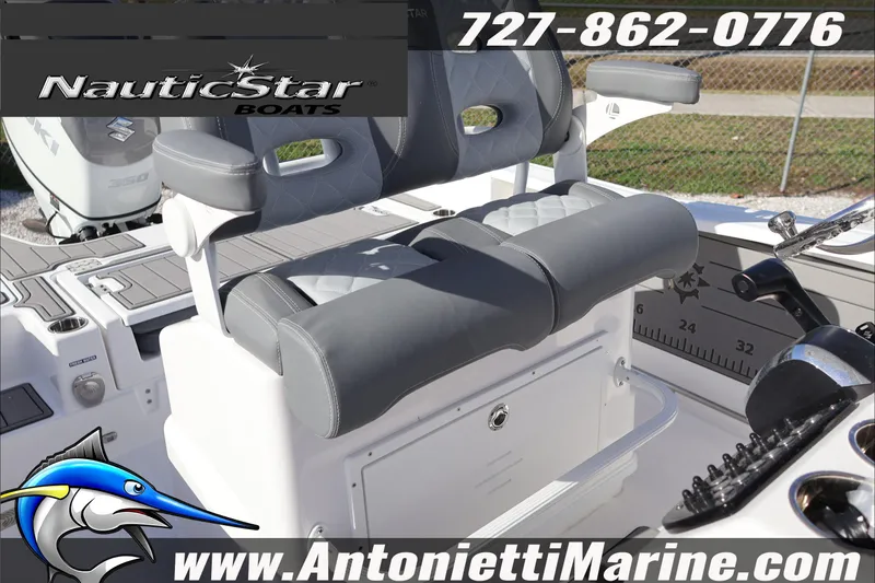 Slide: The Image of 2026 NauticStar 251 Hybrid boat interior with dual seating and control panel. - 25