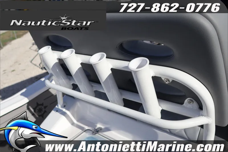 Slide: The Image of 2026 NauticStar 251 Hybrid boat with rod holders, contact info, and website details. - 31
