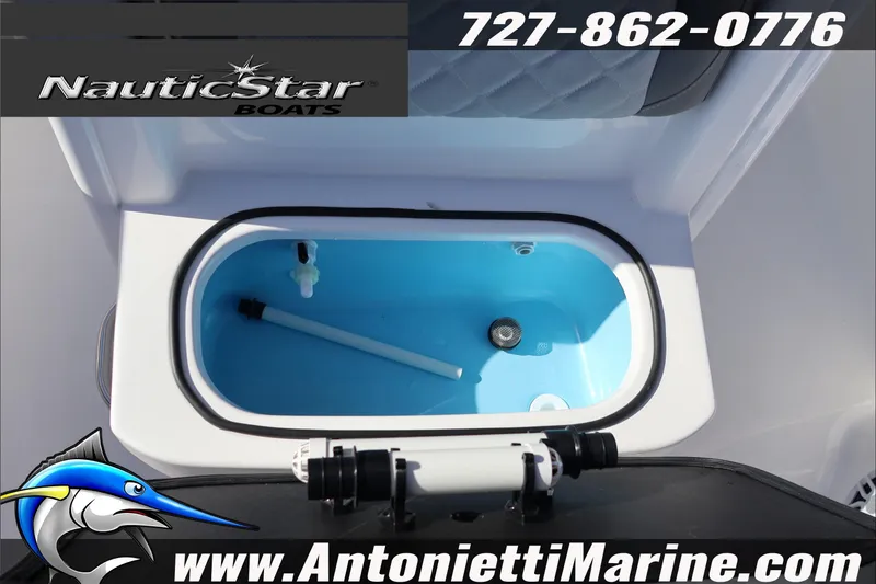 Slide: The Image of 2026 NauticStar 251 Hybrid boat livewell, featuring blue interior and marine equipment. - 34