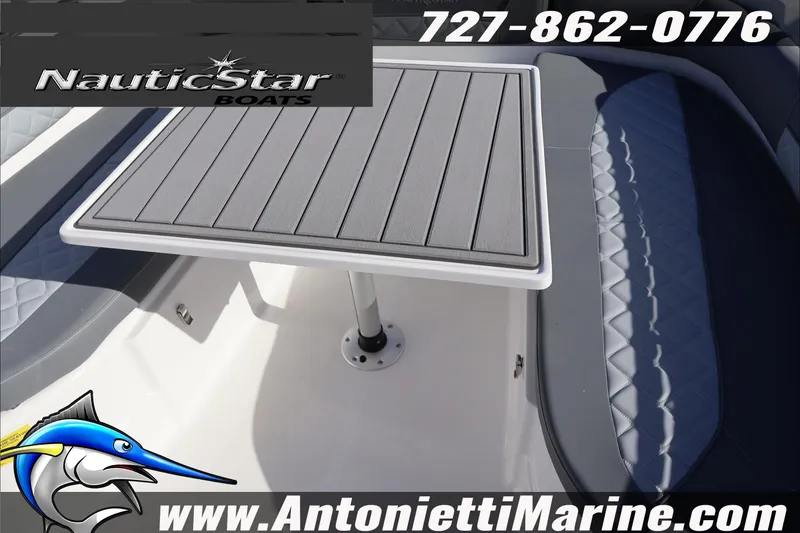Slide: The Image of 2026 NauticStar 251 Hybrid boat interior with table and seating, Antonietti Marine branding. - 35