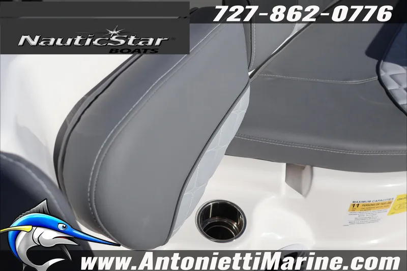 Slide: The Image of 2026 NauticStar 251 Hybrid boat interior with gray seating and cup holder. - 37