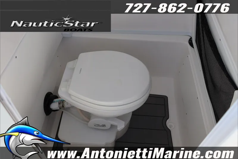 Slide: The Image of 2026 NauticStar 251 Hybrid boat interior with marine toilet, contact details visible. - 41