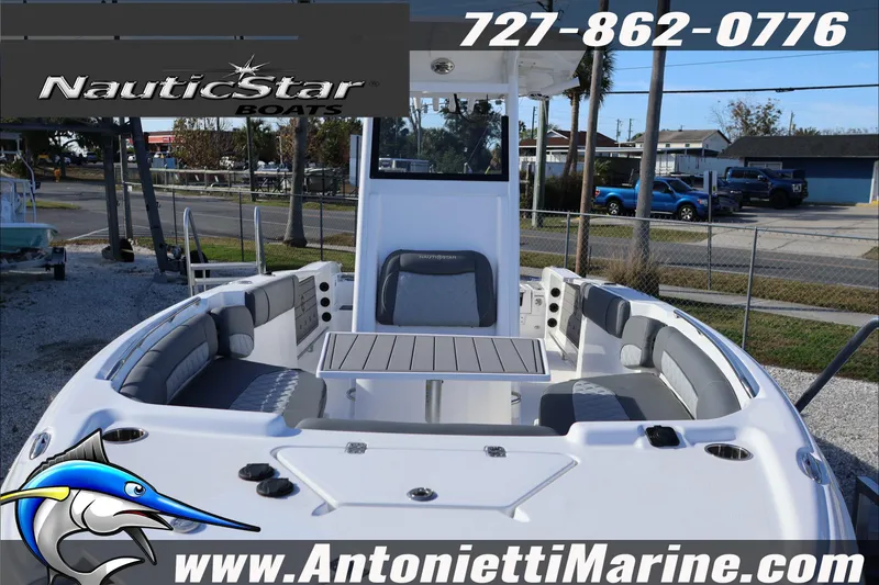 Slide: The Image of 2026 NauticStar 251 Hybrid boat interior with seating and table, displayed at Antonietti Marine. - 7