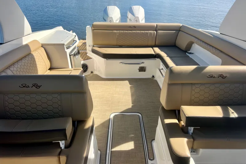Slide: The Image of Luxurious 2019 Sea Ray SDX 290 Outboard boat interior with plush seating and scenic water view. - 28