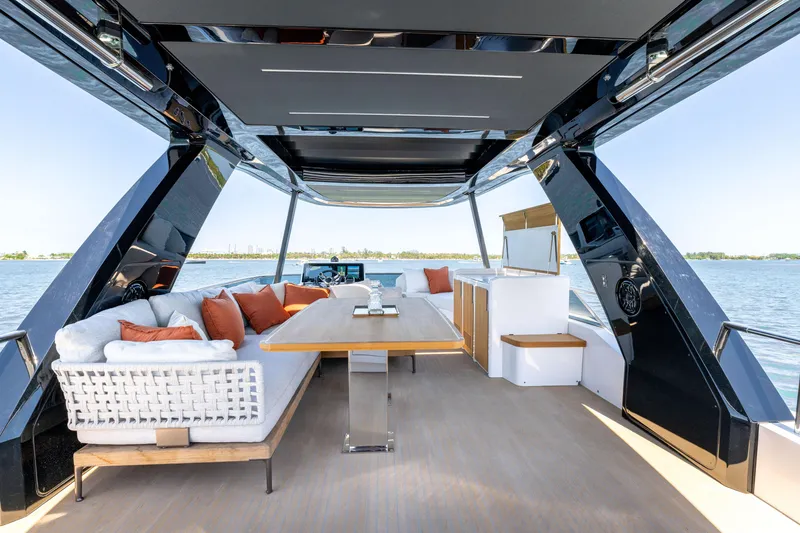 Slide: The Image of Luxurious 2027 Pardo Yachts E72 interior with elegant seating and dining area on open water. - 20