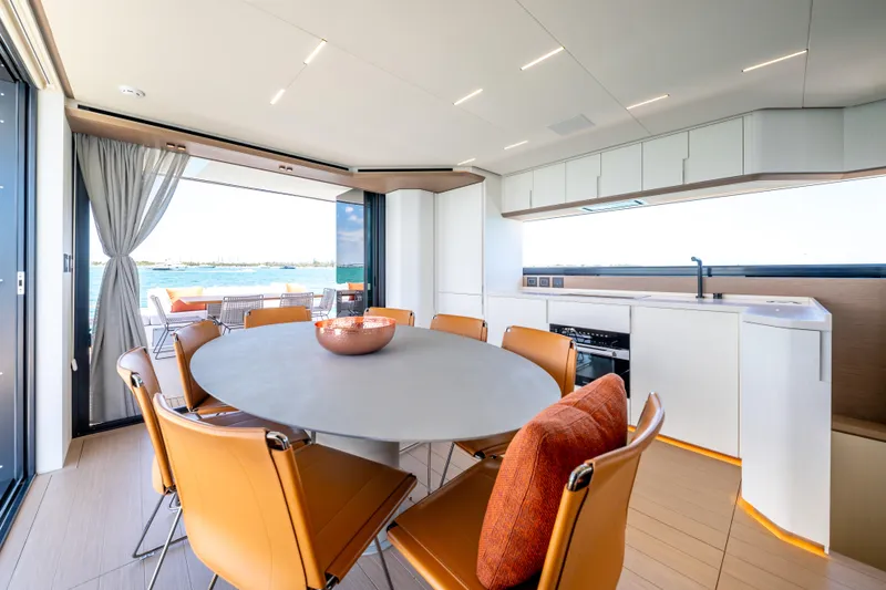 Slide: The Image of Luxurious interior of 2027 Pardo Yachts E72 with modern dining area and ocean view. - 25