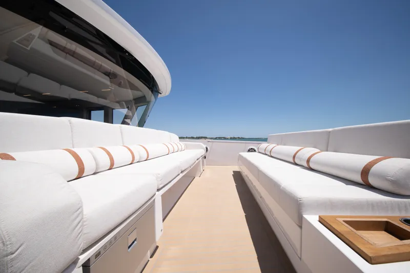 Slide: The Image of Luxurious deck seating on 2027 Pardo Yachts E72 under clear blue sky. - 28