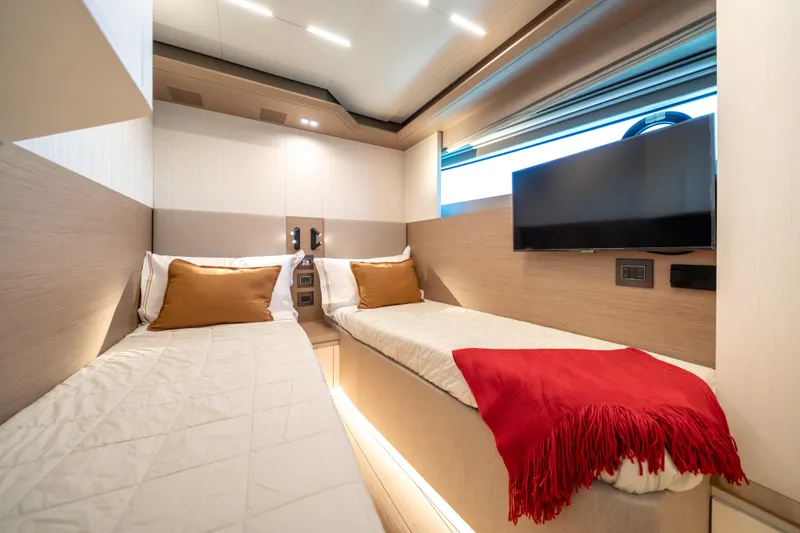 Slide: The Image of Luxurious cabin interior of 2027 Pardo Yachts E72 with twin beds and modern decor. - 31