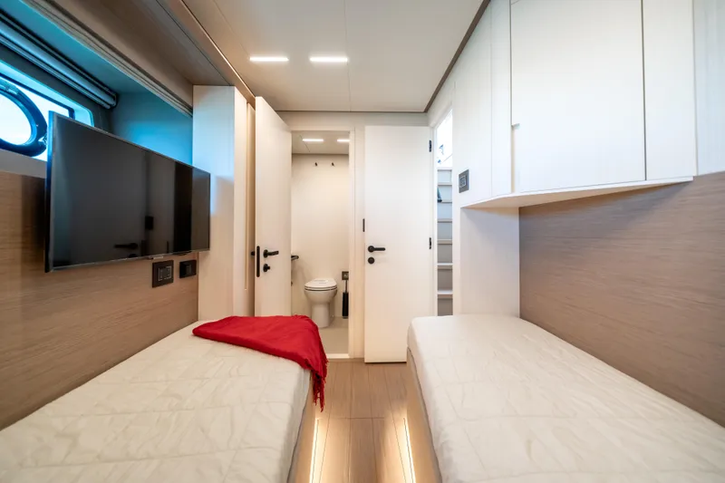 Slide: The Image of Luxurious cabin interior of 2027 Pardo Yachts E72 with twin beds and modern amenities. - 32