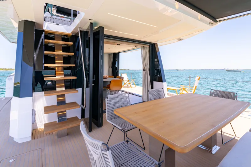 Slide: The Image of Luxurious 2027 Pardo Yachts E72 interior with elegant dining area and ocean view. - 16