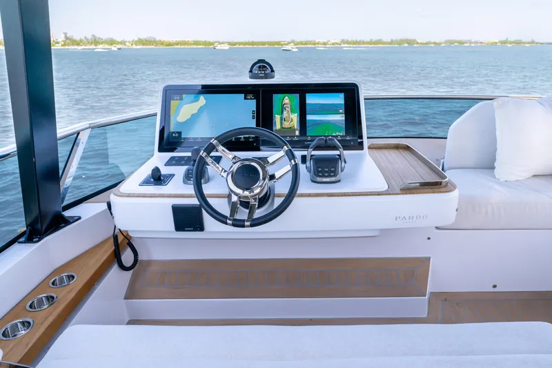 Slide: The Image of Helm of 2027 Pardo Yachts E72 with advanced navigation displays and luxurious seating. - 17