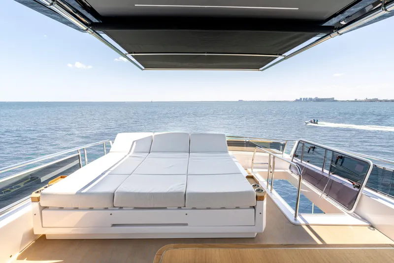 Slide: The Image of Luxurious Pardo Yachts E72 deck with sunbed, ocean view, and retractable canopy, 2027 model. - 19