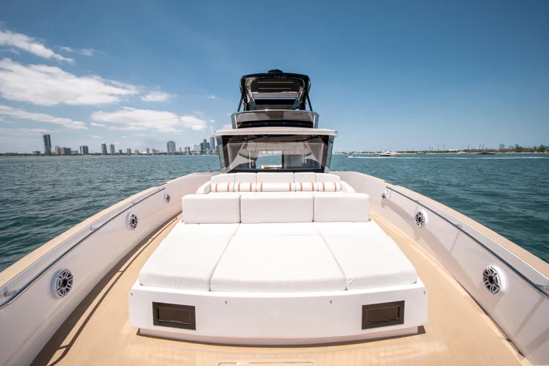 Slide: The Image of Luxury Pardo Yachts E72, 2027 model, cruising on open water with city skyline backdrop. - 29