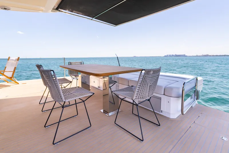 Slide: The Image of Luxury deck of 2027 Pardo Yachts E72 with ocean view and seating area. - 6