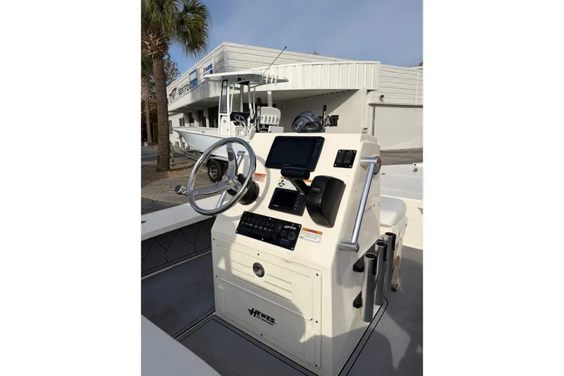 Slide: The Image of 2021 Hewes Redfisher 16 boat console with steering wheel and navigation equipment. - 4