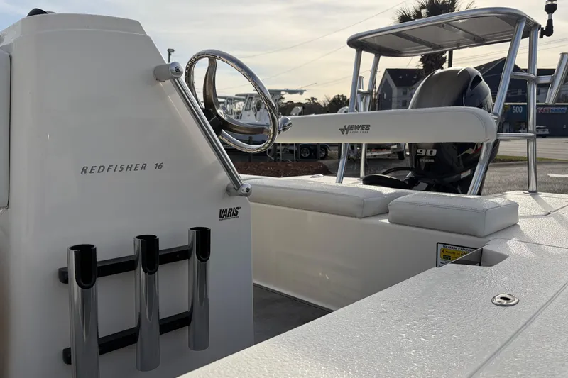 Slide: The Image of 2021 Hewes Redfisher 16 boat interior with steering wheel and seating. - 5