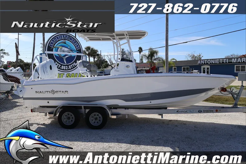 The Image of 2026 NauticStar 231 Hybrid boat on trailer at Antonietti Marine dealership. - 0