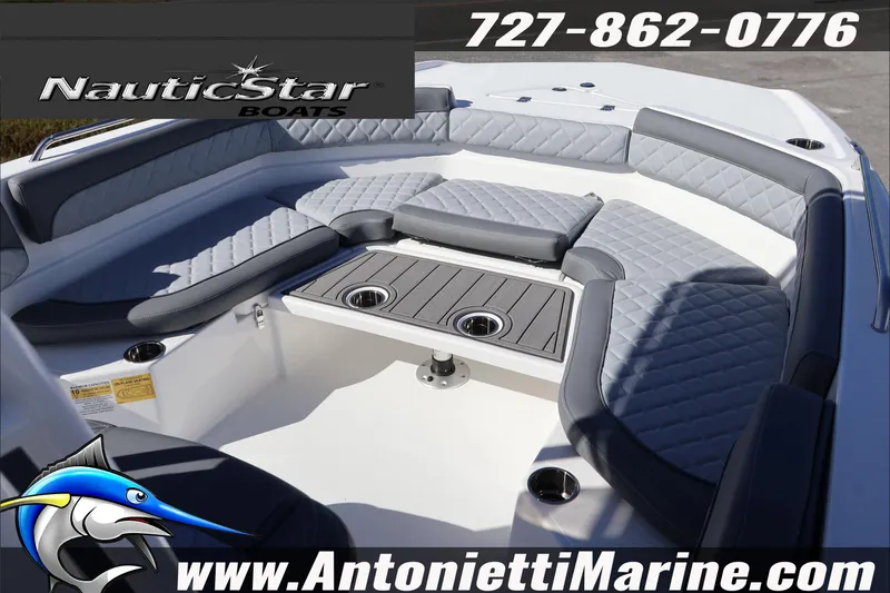 Slide: The Image of 2026 NauticStar 231 Hybrid boat interior with cushioned seating and table. - 10