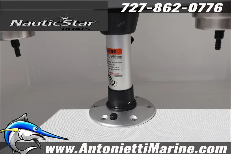 Slide: The Image of NauticStar 231 Hybrid 2026 boat pedestal with contact details and logo. - 18