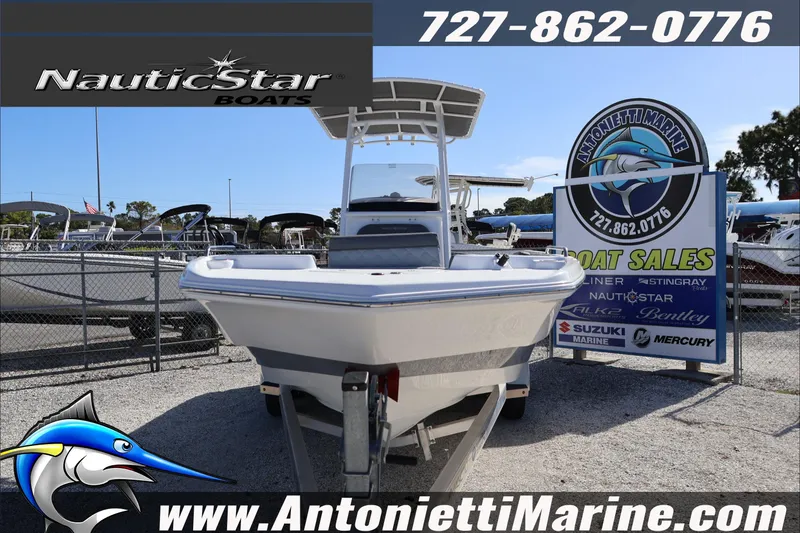 Slide: The Image of 2026 NauticStar 231 Hybrid boat displayed at Antonietti Marine sales lot. - 2