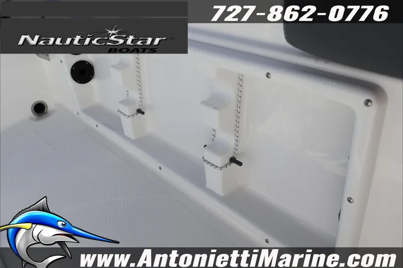 Slide: The Image of 2026 NauticStar 231 Hybrid boat interior detail with branding and contact information. - 26