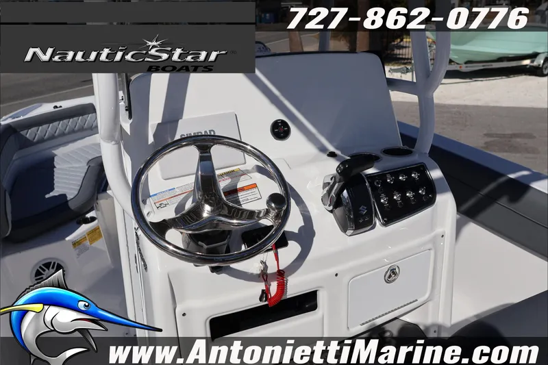 Slide: The Image of 2026 NauticStar 231 Hybrid boat dashboard with steering wheel and controls, Antonietti Marine branding. - 29