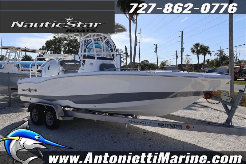 Slide: The Image of 2026 NauticStar 231 Hybrid boat on trailer at Antonietti Marine dealership. - 3