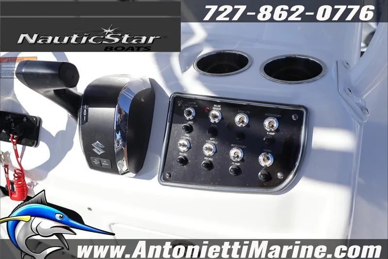 Slide: The Image of 2026 NauticStar 231 Hybrid boat control panel with switches and throttle. - 34