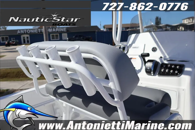 Slide: The Image of 2026 NauticStar 231 Hybrid boat interior with rod holders and control panel. - 36