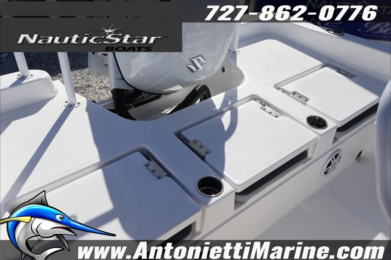 Slide: The Image of 2026 NauticStar 231 Hybrid boat interior with storage compartments and cup holders. - 38