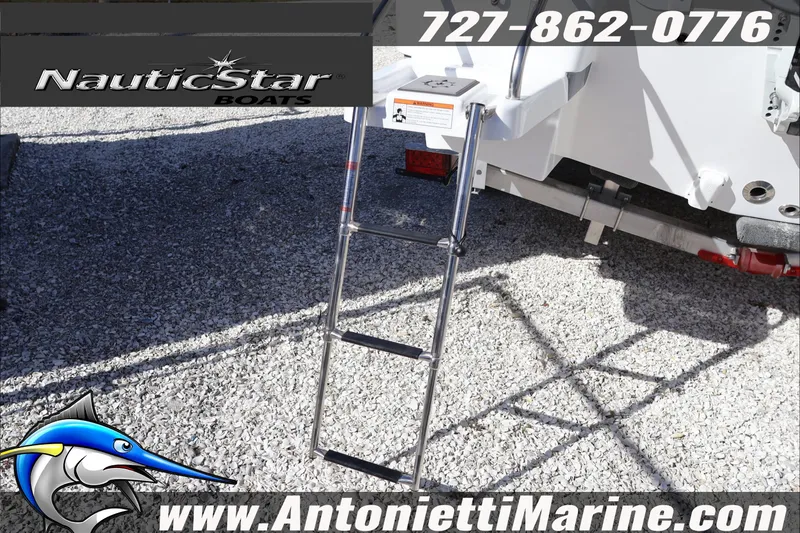 Slide: The Image of NauticStar 231 Hybrid 2026 boat ladder and branding details on display. - 6