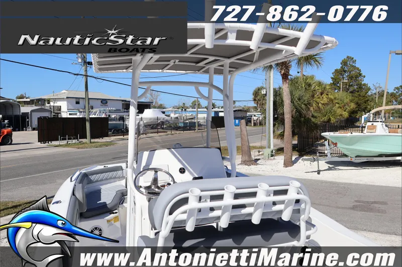 Slide: The Image of 2026 NauticStar 231 Hybrid boat displayed at Antonietti Marine dealership. - 9