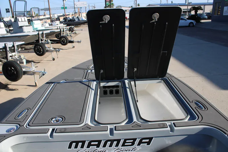 Slide: The Image of Open storage compartments on a 2025 Mamba 227VX boat, showcasing spacious design. - 12