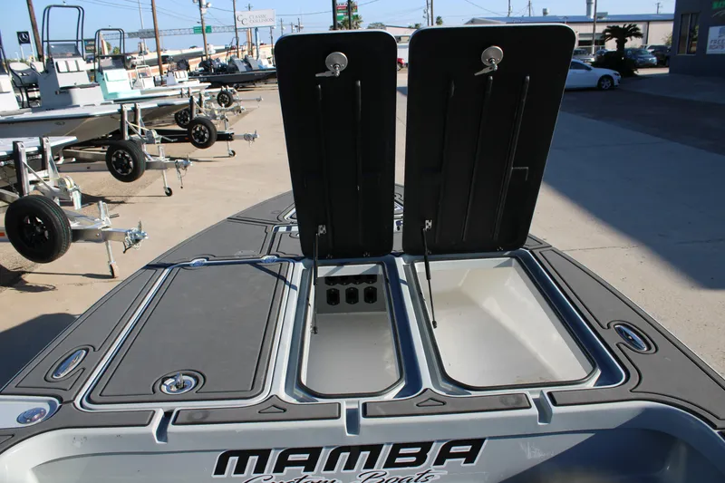 Slide: The Image of Open storage compartments on a 2025 Mamba 227VX boat, showcasing spacious design. - 13