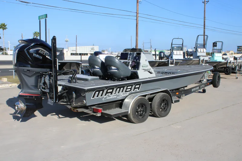 Slide: The Image of 2025 Mamba 227VX boat on trailer, featuring Yamaha engine, parked outdoors. - 18