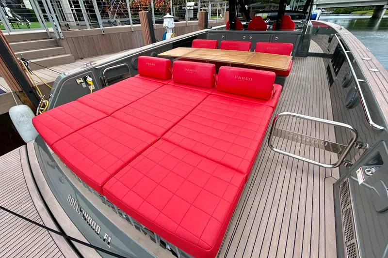 Slide: The Image of Luxury 2023 Pardo Yachts 43 with red seating and wooden deck, docked in Hollywood, FL. - 14