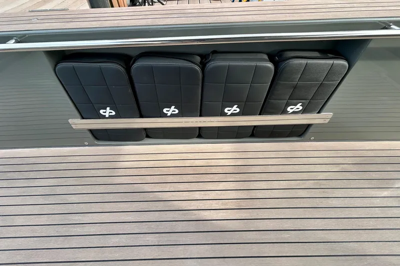 Slide: The Image of Pardo Yachts 43, 2023 model, featuring sleek black cushions on a wooden deck. - 20