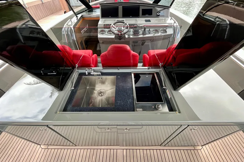 Slide: The Image of Luxury Pardo Yachts 43 cockpit with sleek design, red seats, and modern amenities, 2023 model. - 21