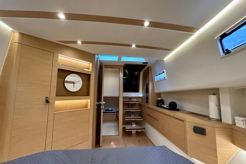 Slide: The Image of Luxurious interior of 2023 Pardo Yachts 43, featuring modern wood finishes and ambient lighting. - 35