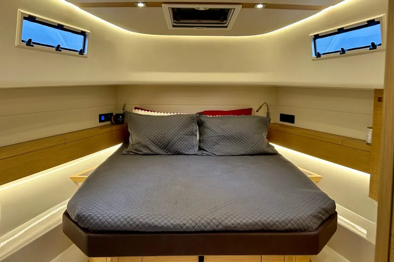 Slide: The Image of Luxurious cabin interior of 2023 Pardo Yachts 43, featuring a cozy bed and modern design. - 39
