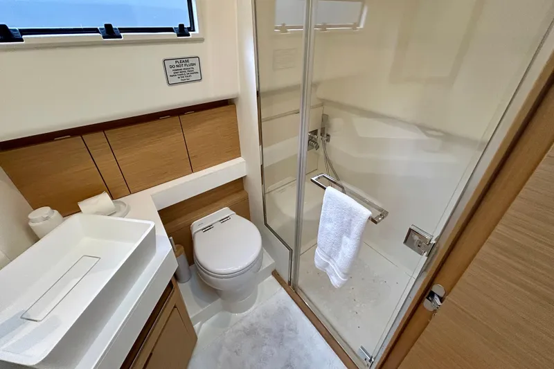 Slide: The Image of Luxurious bathroom in 2023 Pardo Yachts 43, featuring modern fixtures and glass shower. - 42
