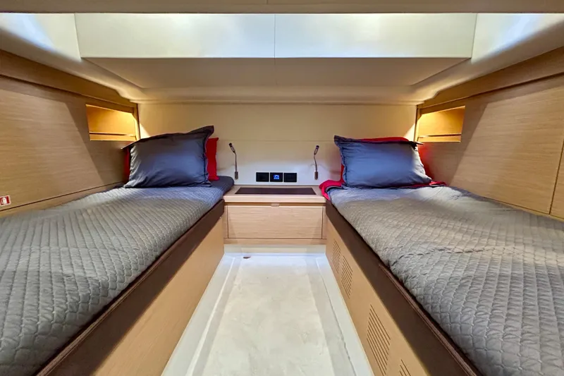 Slide: The Image of Luxurious twin cabin interior of 2023 Pardo Yachts 43, featuring modern wood finishes. - 43
