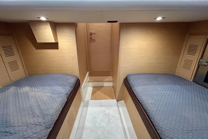 Slide: The Image of Interior cabin of 2023 Pardo Yachts 43 with twin beds and wooden finish. - 44