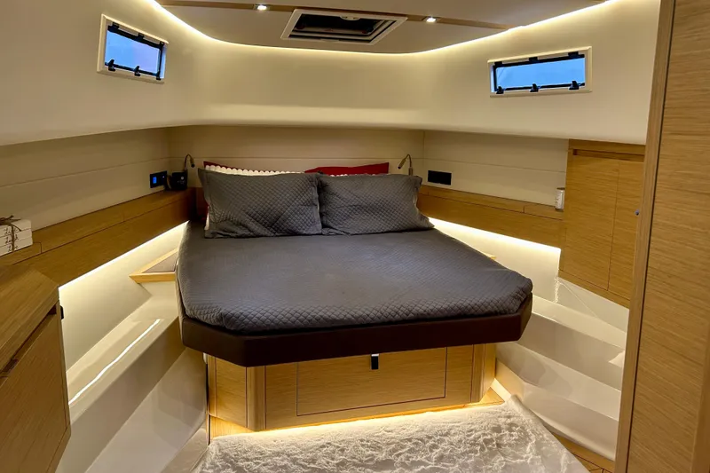 Slide: The Image of Luxurious cabin interior of 2023 Pardo Yachts 43, featuring a cozy bed and modern design. - 38