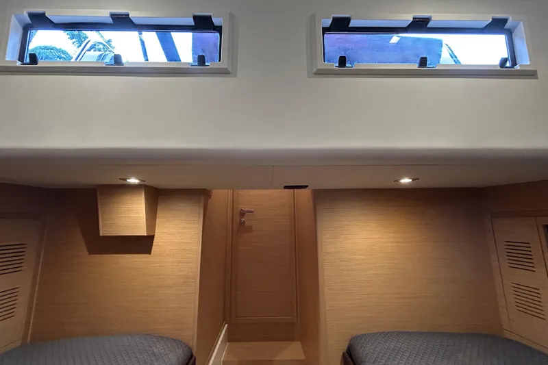 Slide: The Image of Interior cabin of 2023 Pardo Yachts 43 with modern wood finish and windows. - 45