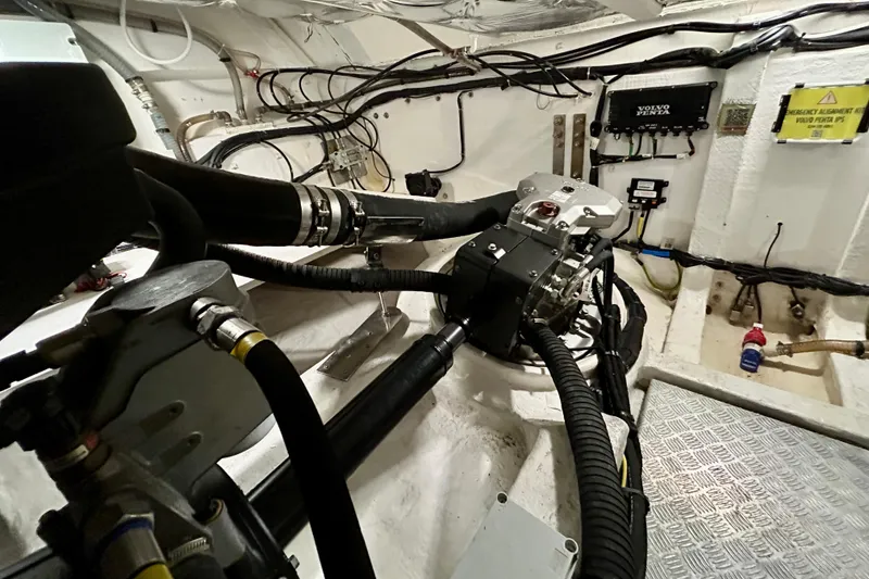 Slide: The Image of Engine room of 2023 Pardo Yachts 43, featuring complex wiring and mechanical components. - 53